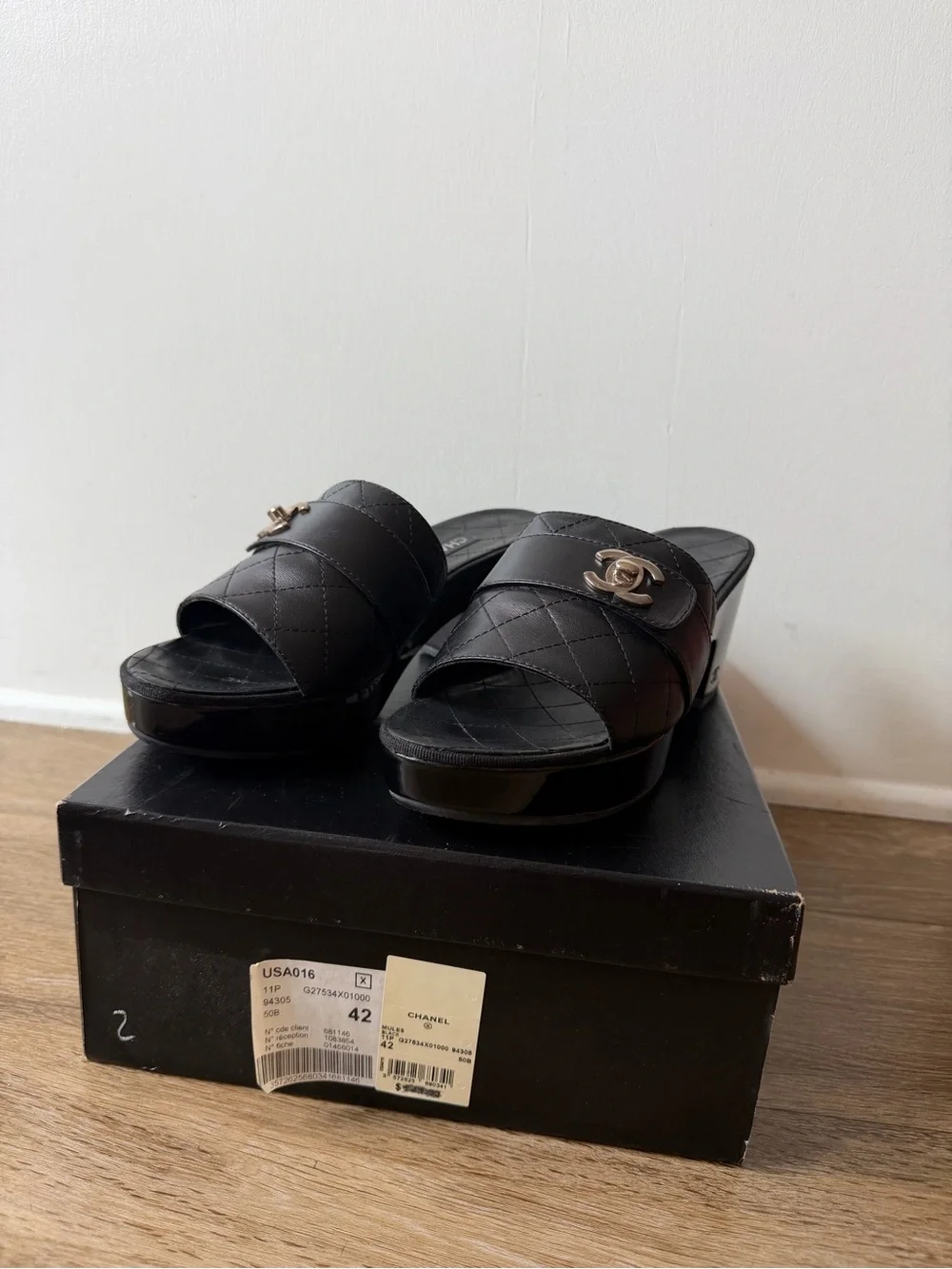CHANEL Black Quilted Leather Slide Mules